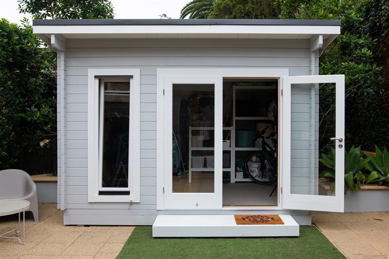 Detached backyard ADU with open glass doors