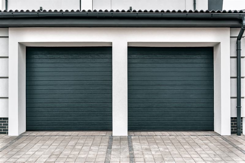 Modern two-car garage with dark panel doors