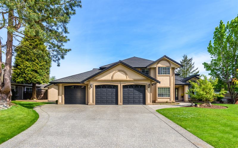 Two-story home above a three-car garage