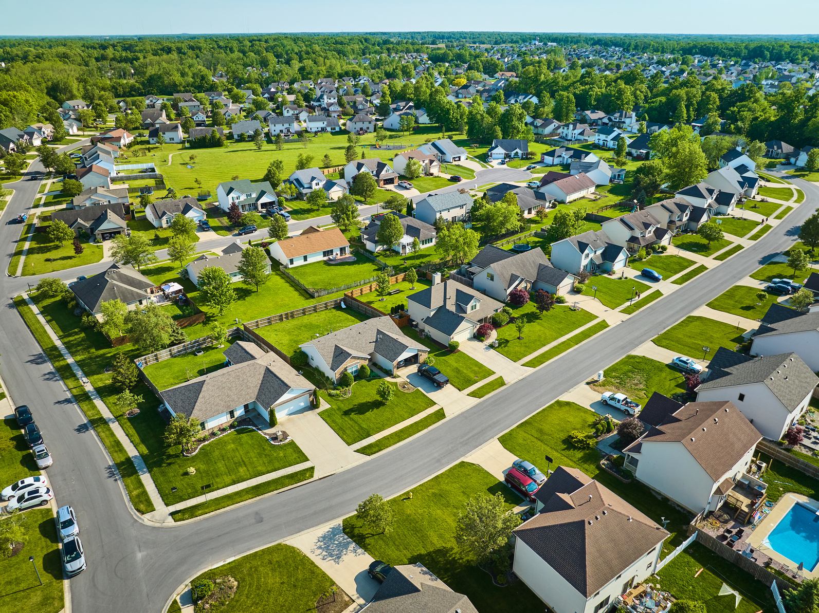 Aerial view of a neighborhood of single-family homes with backyards